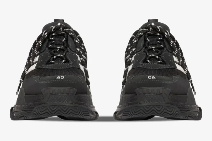 Front view of Balenciaga Triple S x Adidas sneakers in black and white with chunky soles and patterned laces. - SKU 712821W2ZB21090