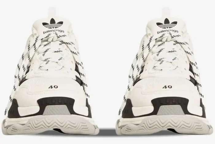 Front view of Balenciaga Triple S x Adidas sneakers in white and black with chunky soles. - SKU 710021W2ZB19112