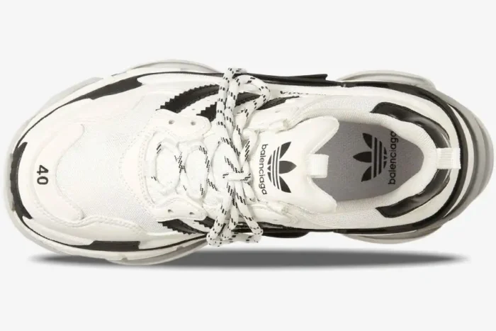 Top-down view of Balenciaga Triple S x Adidas collaboration sneaker in white and black with co-branded details. - SKU 710021W2ZB19112