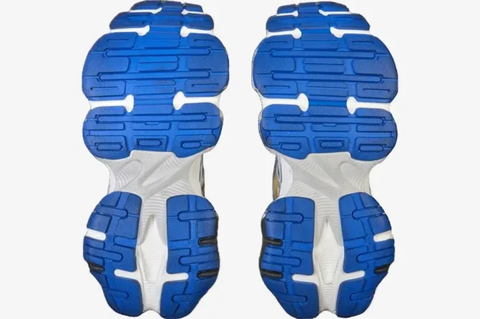 Bottom view of Balenciaga Cargo Sneaker outsoles in blue and white with chunky tread pattern. - SKU 785754W2MV11940