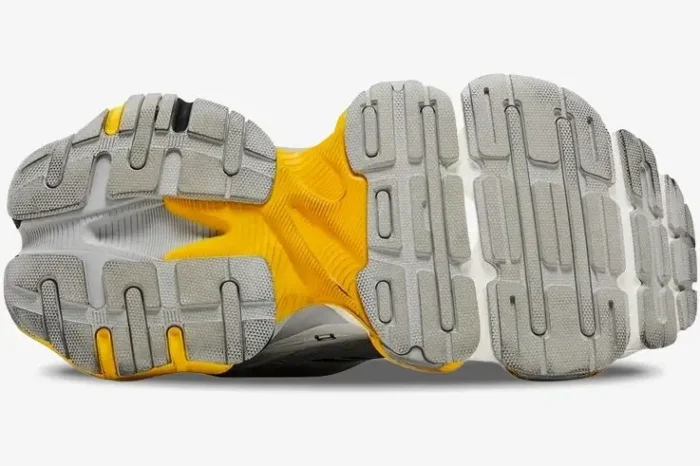 Bottom view of Balenciaga Cargo Sneaker in worn-out grey and yellow showing the chunky tread pattern. - SKU 784341W2MV11170