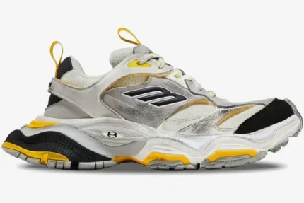 Side profile of Balenciaga Cargo Sneaker in worn-out grey, yellow, and black. - SKU 784341W2MV11170