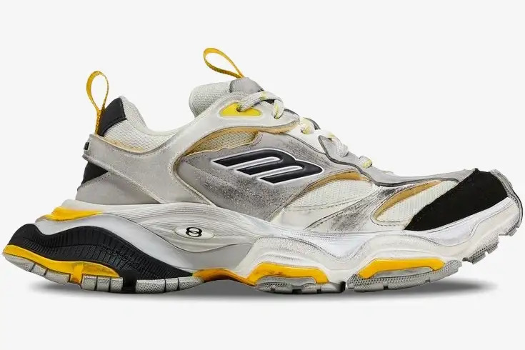 balenciaga-cargo-sneaker-grey-yellow-side-view-784341w2mv11170-845-242 Side profile of Balenciaga Cargo Sneaker in worn-out grey, yellow, and black. - SKU 784341W2MV11170