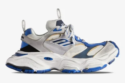 Side view of Balenciaga Cargo Sneaker in white, grey, and blue featuring a distressed, chunky design. - SKU 785754W2MV11940