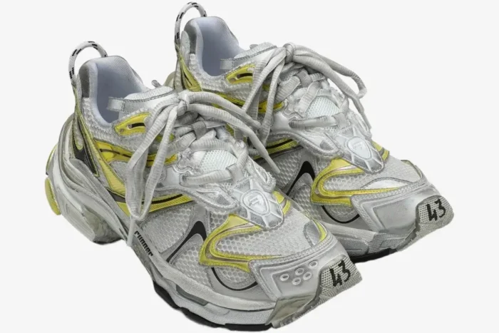Balenciaga Runner 2 sneakers in distressed yellow and silver mesh, three-quarter front view. - SKU 779066W3RXP9710