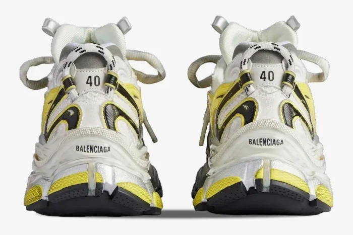 Rear view of Balenciaga Runner 2 sneakers in yellow and silver with distressed mesh and size 40 heel tabs. - SKU 779066W3RXP9710