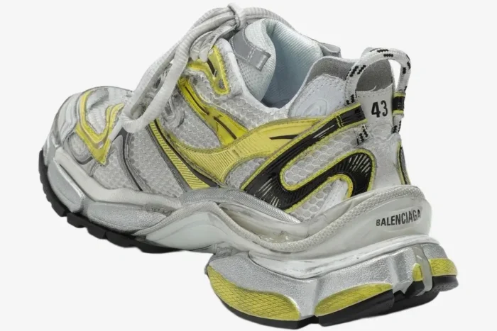 Rear view of Balenciaga Runner 2 sneakers in yellow and silver distressed mesh with a chunky sole. - SKU 779066W3RXP9710