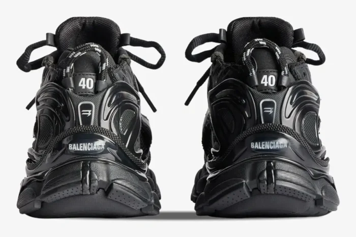 Rear view of Balenciaga Runner all black distressed sneakers showing heel details and size 40. - SKU 772774W3RBT1000