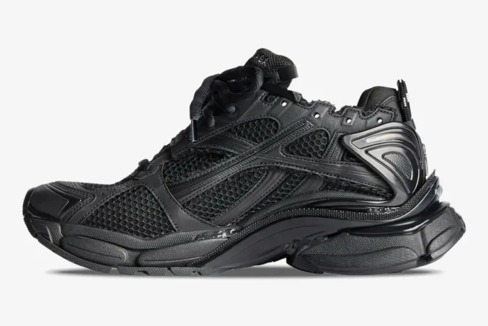 Balenciaga Runner All Black Distressed Sneaker in a side profile view with mesh and layered details. - SKU 772774W3RBT1000