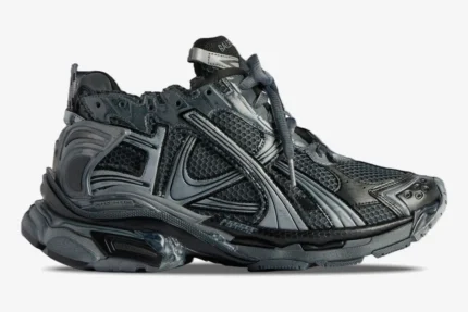 Side profile of Balenciaga Runner Sneaker BL206 in distressed grey and silver with mesh panels. - SKU 677403W3RB11000