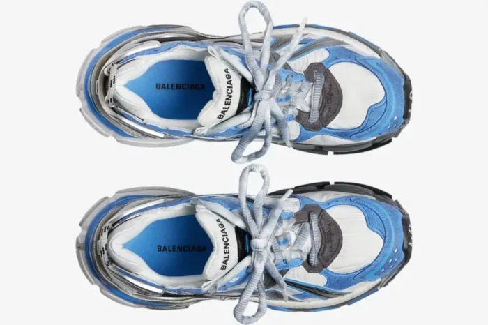Top-down view of Balenciaga Runner sneakers in blue, white, and grey with a distressed, worn-in look. - SKU 677403W3RB14912