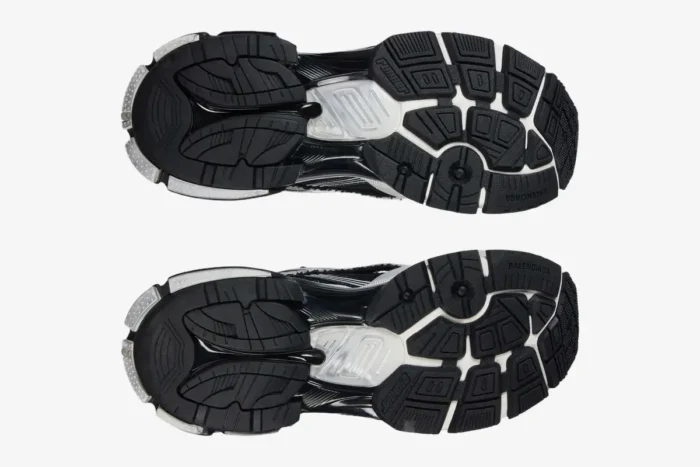 Bottom view of Balenciaga Runner Sneaker Distressed Edition in black and white showing the tread pattern. - SKU 772774W3RMU9010