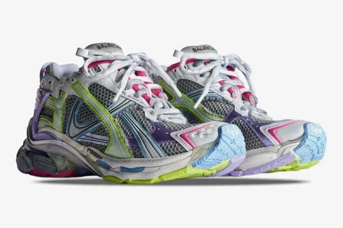 Distressed multi-color Balenciaga Runner sneakers shown from a low front angle. - SKU 772767W3RMU1745