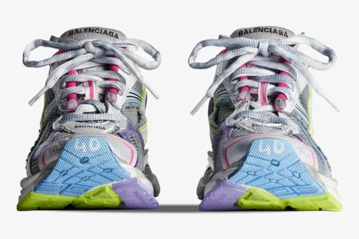 Front view of Balenciaga Runner Sneakers in distressed multi-color showing blue and lime soles. - SKU 772767W3RMU1745