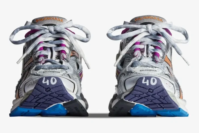 Front view of Balenciaga Runner sneakers in distressed silver and white with multicolor accents. - SKU 772774W3RMU8123