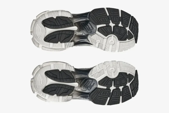 Bottom view of Balenciaga Runner Gradient Sneakers in white and black, showcasing the detailed outsole design. - SKU 677403W3RB19010