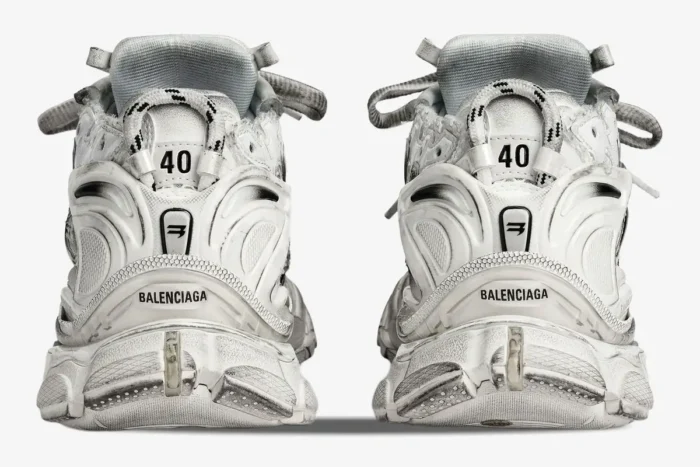 Rear view of Balenciaga Runner Gradient sneakers in white and black with distressed finish and size 40 detail. - SKU 677403W3RB19010