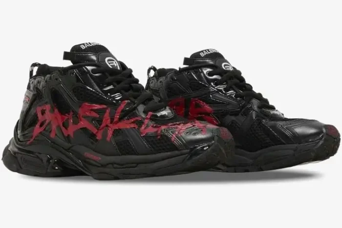 Balenciaga Runner Graffiti sneakers in black and red, three-quarter side view showing distressed details. - SKU 677403W3RBQ1060