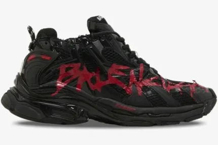 Side view of Balenciaga Runner Graffiti sneakers in black with red distressed details. - SKU 677403W3RBQ1060