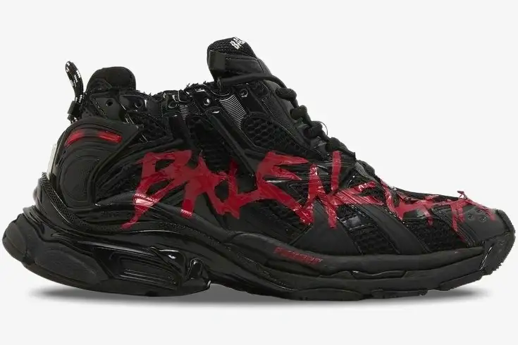 balenciaga-runner-graffiti-black-red-side-view-677403w3rbq1060-810-185 Side view of Balenciaga Runner Graffiti sneakers in black with red distressed details. - SKU 677403W3RBQ1060