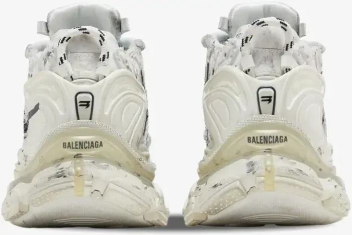 Rear view of Balenciaga Runner Graffiti White Black sneakers featuring distressed soles and heel branding. - SKU 677403W3RBQ9010