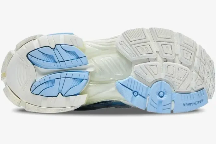 Bottom view of the Balenciaga Runner Sneaker in light blue and white, showing the detailed outsole tread. - SKU 677402W3RB29744