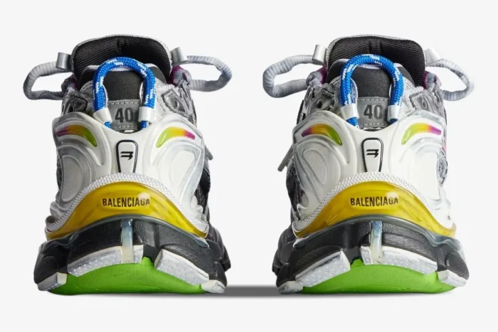 Rear view of Balenciaga Runner sneakers in multicolor distressed silver and white with yellow heel accents. - SKU 772774W3RMU8123
