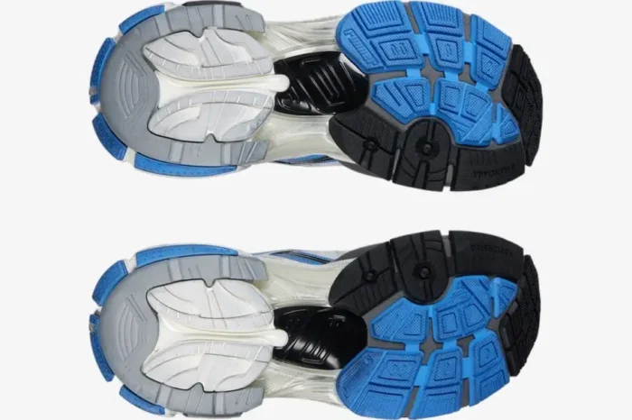 Bottom view of Balenciaga Runner Sneakers in blue, white, and grey showing the textured, distressed outsoles. - SKU 677403W3RB14912