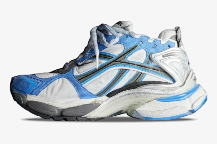Side profile of a Balenciaga Runner Sneaker in blue, white, and grey with a distressed finish. - SKU 677403W3RB14912