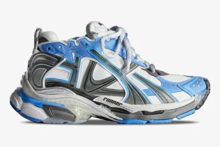 Balenciaga Runner Sneaker in blue, white, and grey distressed mesh, side profile view on white background. - SKU 677403W3RB14912