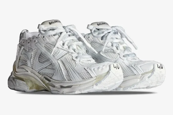 White Balenciaga Runner sneakers shown from a three-quarter front angle on a white background. - SKU 772774W3RMU9000