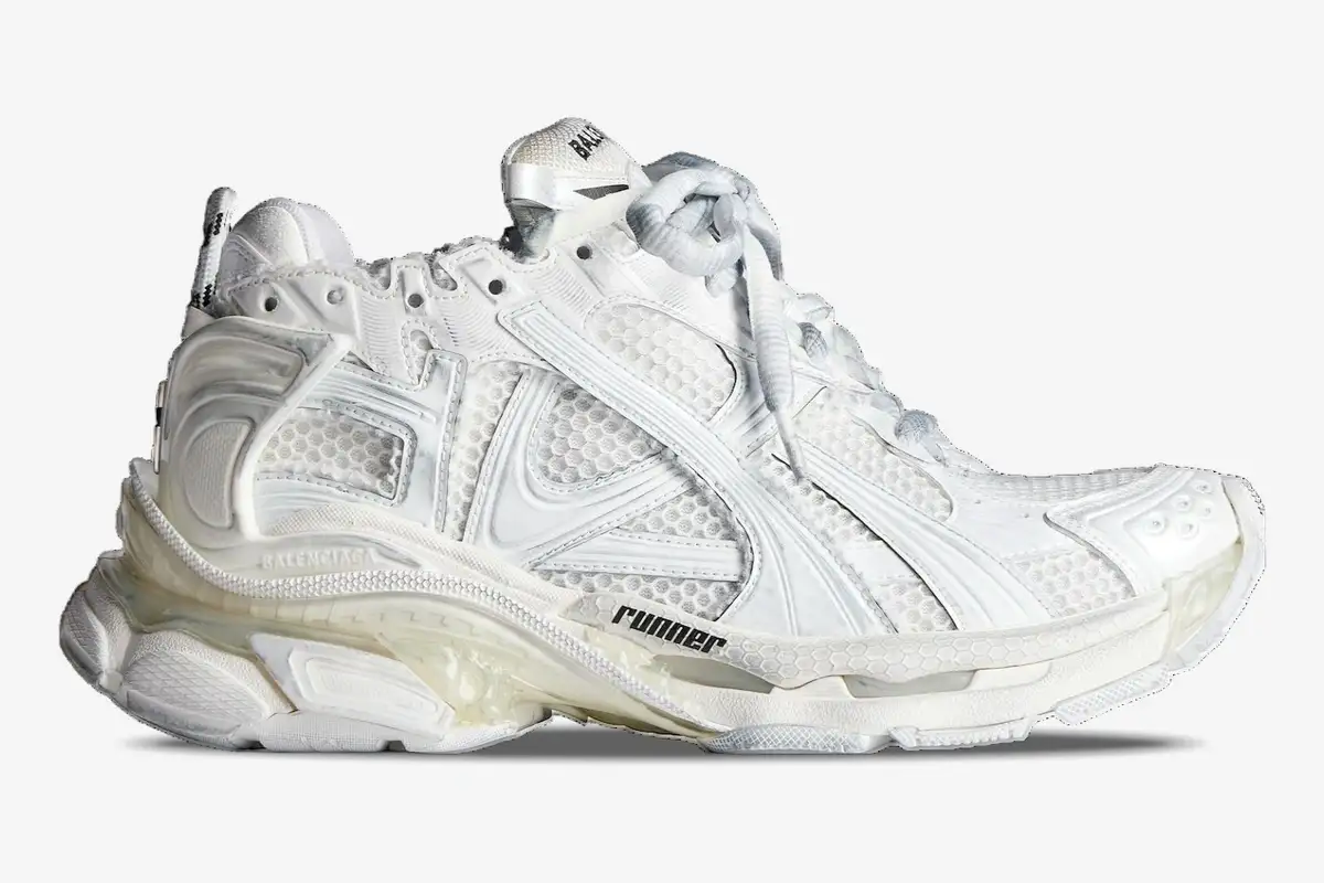 balenciaga-runner-sneakers-white-side-view-772774w3rmu9000-712-580 Side view of white Balenciaga Runner sneakers featuring a chunky, multi-layered mesh and nylon design. - SKU 772774W3RMU9000