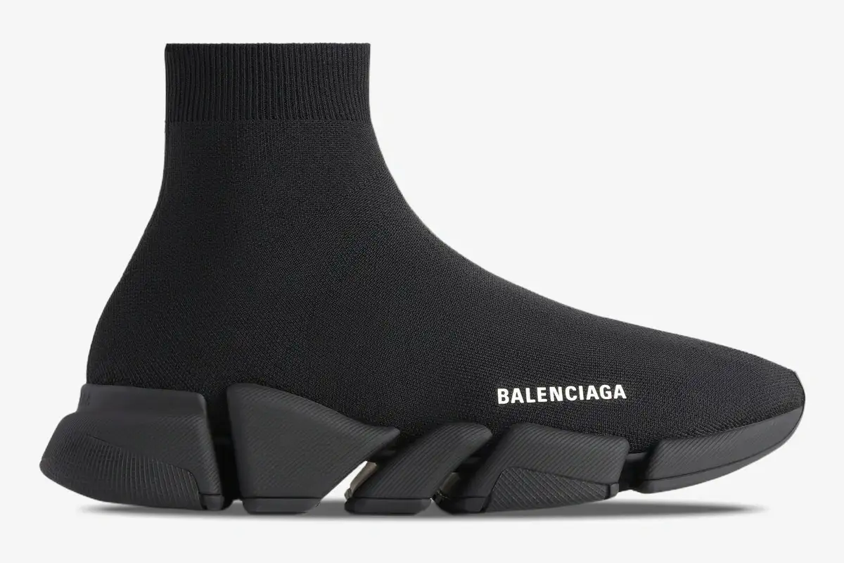 balenciaga-speed-2-0-black-knit-sneaker-side-617239w2db11013-675-864 Side profile of a Balenciaga Speed 2.0 Recycled Knit Sneaker in black with a segmented sole. - SKU 617239W2DB11013