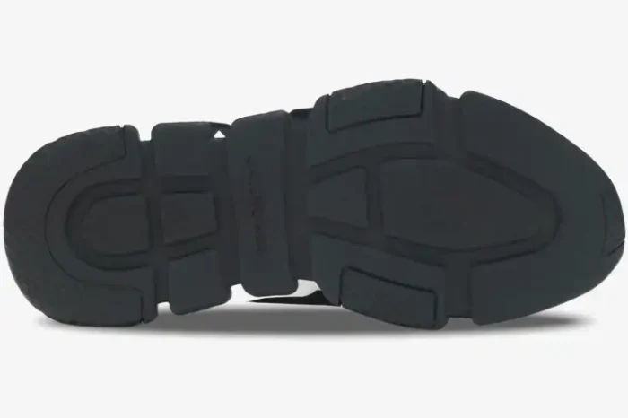 Bottom view of the black chunky sole on a Balenciaga Speed Graffiti Trainer shoe. - SKU 605972W05GE1015