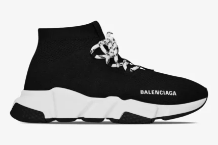 Side profile of a Balenciaga Speed Lace-Up Sneaker in black and white with a thick chunky sole. - SKU 593531W1GV01000