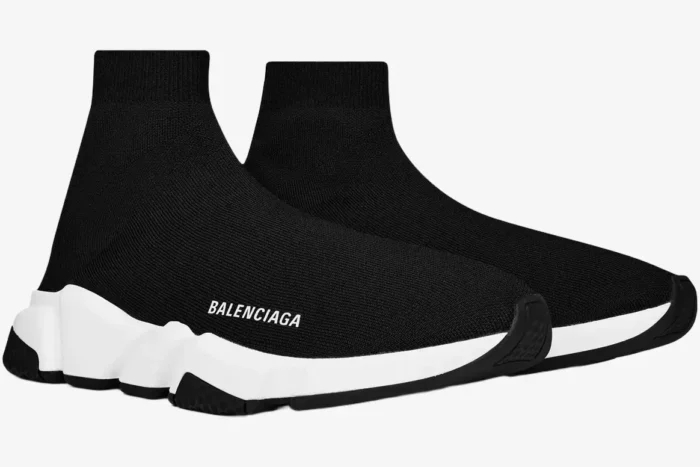 Side view of Balenciaga Speed Trainer sneakers in black and white with a sock-like knit upper. - SKU 483502W05G01000