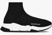 Side profile of a Balenciaga Speed Trainer in black and white with a sock-like knit upper. - SKU 483502W05G01000
