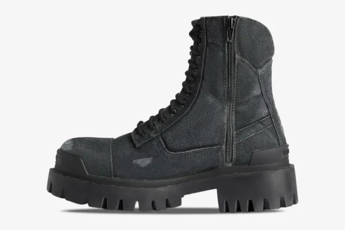 Balenciaga Strike Combat Boot in black distressed canvas, side view on a white background. - SKU 694042W2H111000