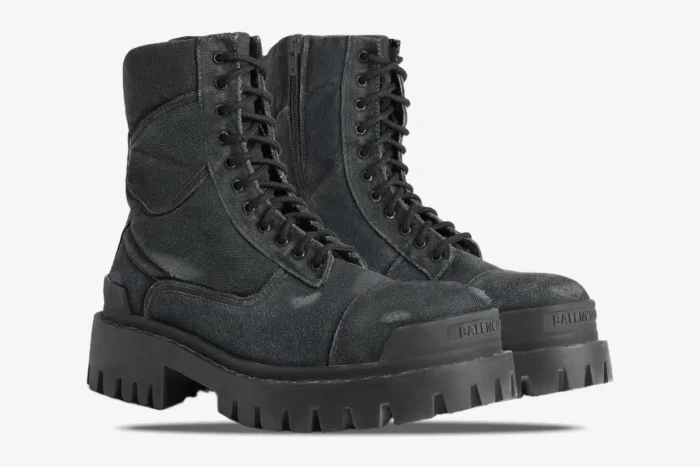 Side view of Balenciaga Strike Combat Boots in distressed black canvas with chunky lug soles. - SKU 694042W2H111000