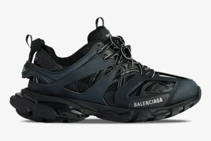 Side profile of Balenciaga Track sneakers in black mesh and nylon with a multi-layered design. - SKU 542023W1GB11000