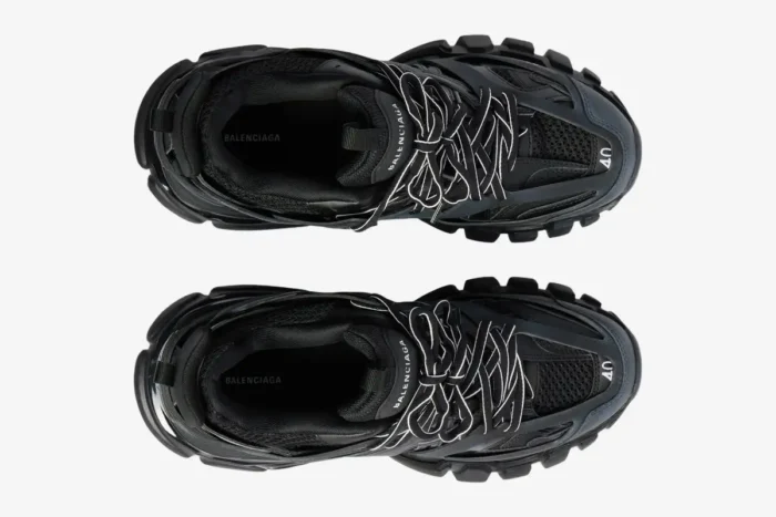 Top-down view of black Balenciaga Track mesh and nylon sneakers with white striped laces. - SKU 542023W1GB11000