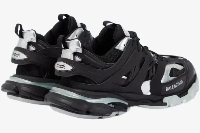 Rear three-quarter view of Balenciaga Track sneakers in black and silver with chunky soles. - SKU 542023 W2FSC1081