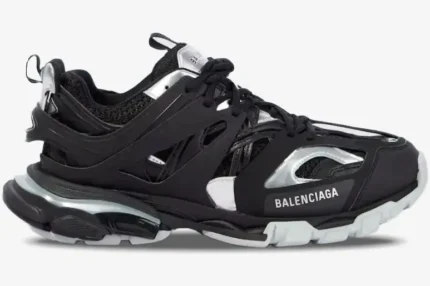 Side profile of Balenciaga Track Black Silver sneaker with metallic accents and layered sole. - SKU 542023 W2FSC1081