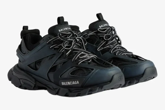 Pair of black Balenciaga Track mesh and nylon sneakers in a three-quarter side view. - SKU 542023W1GB11000