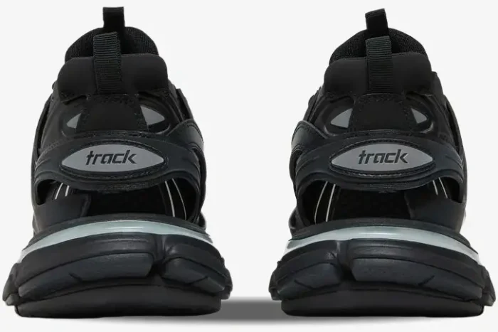 Rear view of black Balenciaga Track Led light-up sneakers showing the heel logo and layered sole. - SKU 555036W2GB11000
