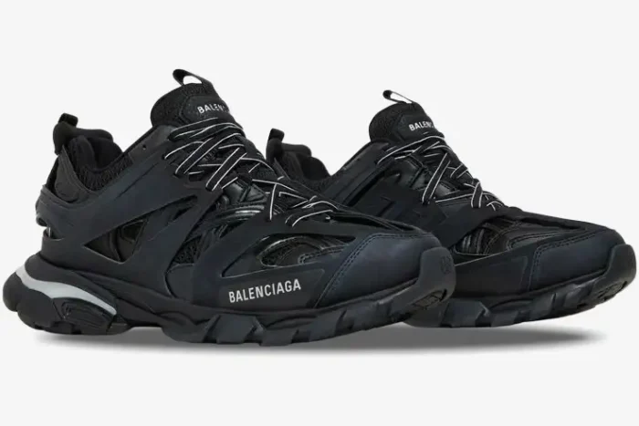 Three-quarter side view of black Balenciaga Track Led light-up sneakers with chunky soles. - SKU 555036W2GB11000