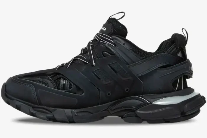 Side view of a Balenciaga Track LED black light-up sneaker with a chunky layered design. - SKU 555036W2GB11000