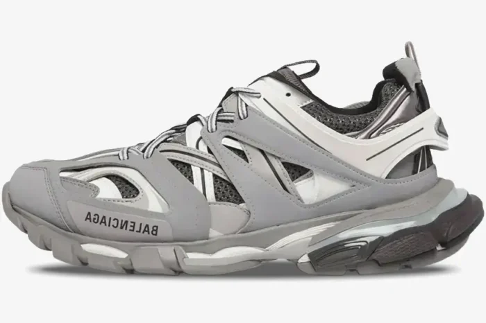 Side profile of a gray Balenciaga Track LED light-up sneaker featuring a multi-layered mesh and nylon design. - SKU 542023W1GB71214