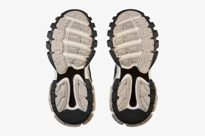 Bottom view of Balenciaga Track Low Sneakers in grey, black, and white showing the tread pattern. - SKU 542023W3SU59791