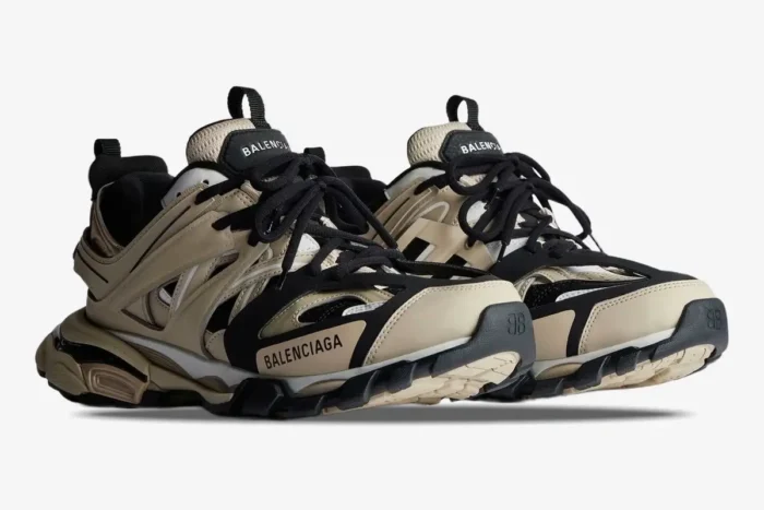 Balenciaga Track Sneaker in beige, black, and white, shown from a low three-quarter front angle. - SKU 542023W3AC48071